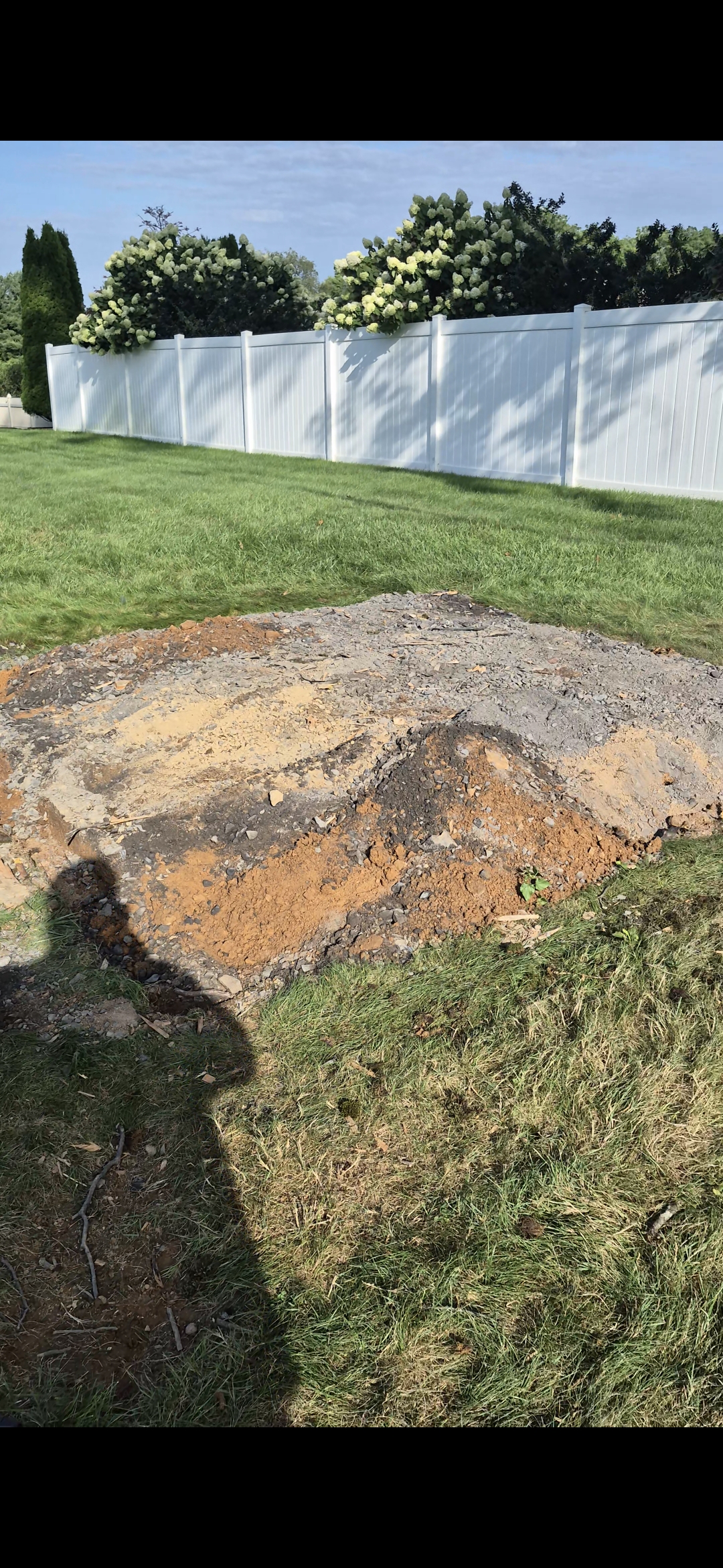 Backyard in Macungie, PA graded and cleared after construction debris removal
