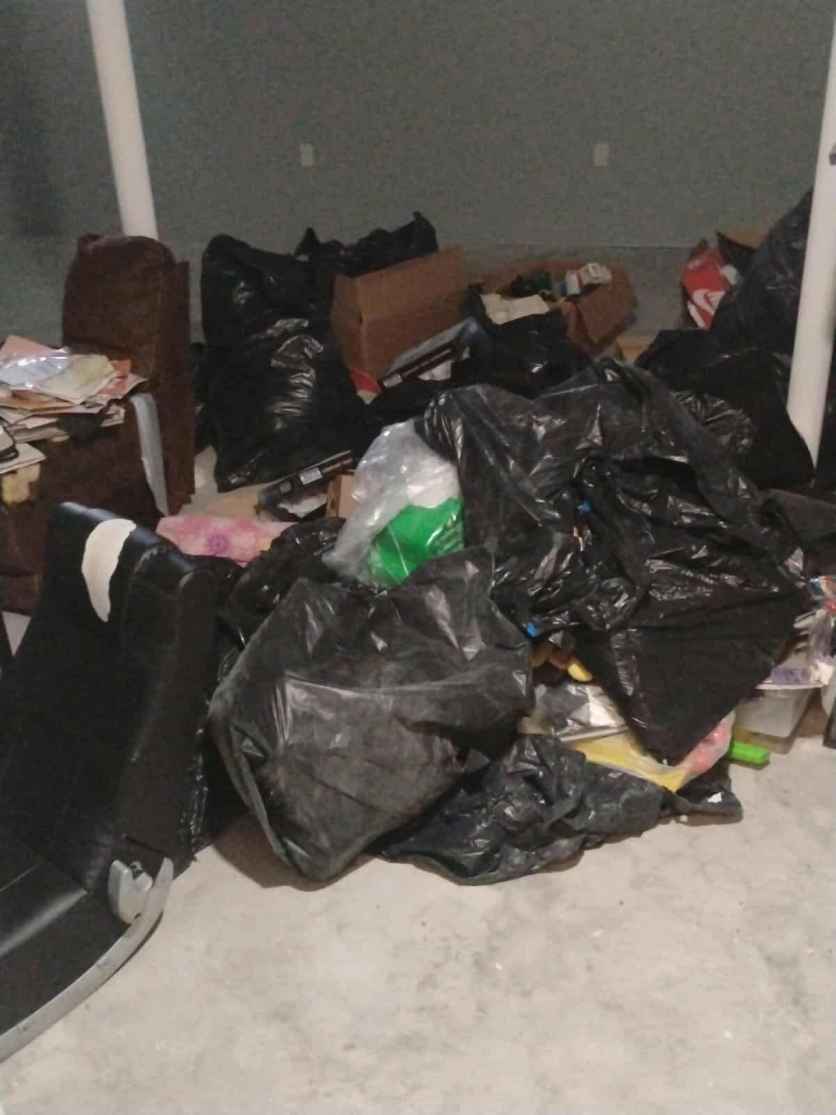 Basement cleanout with bags and boxes