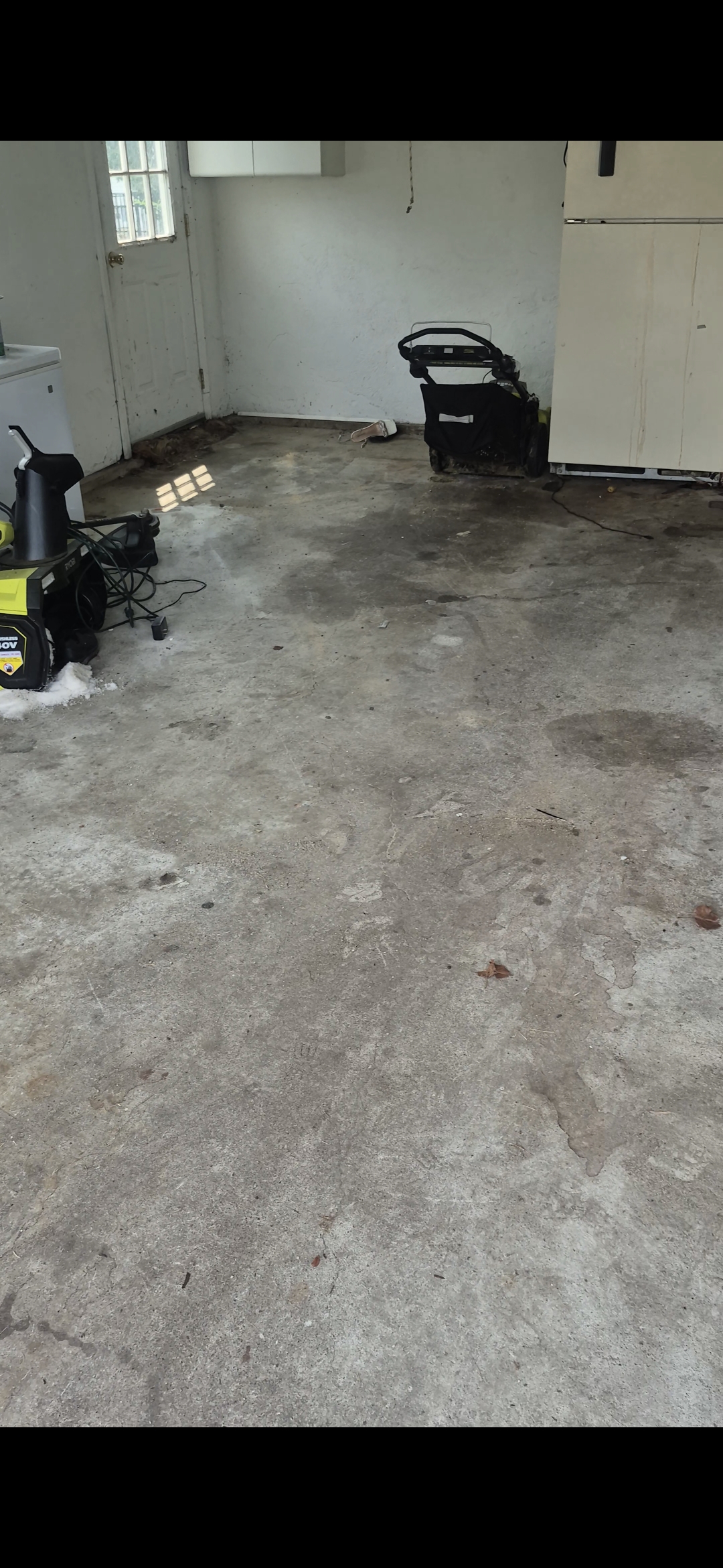 Empty garage in Bethlehem, PA with a clean concrete floor after junk removal