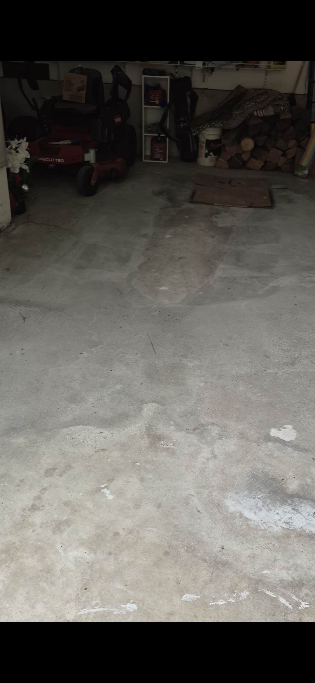 Cleared garage in Easton, PA with a swept concrete floor after junk removal