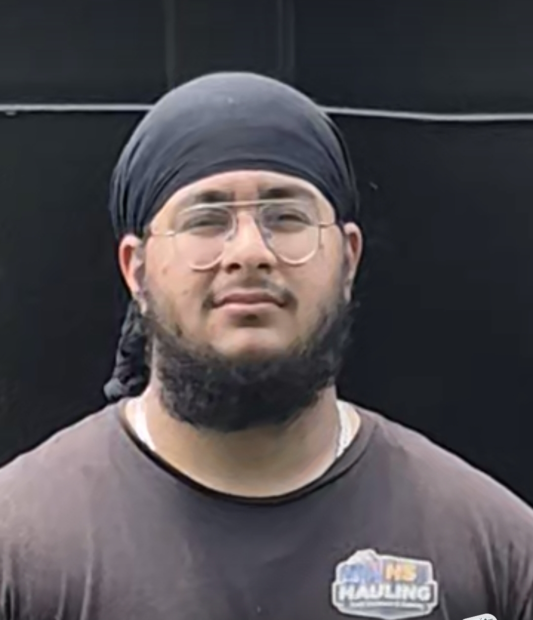 Hargun Jaswal, Owner and Founder of HS Hauling, wearing an HS Hauling t-shirt