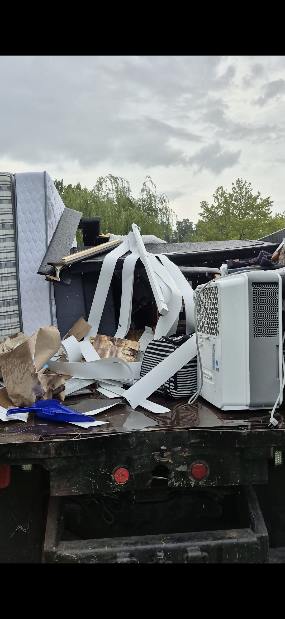 HS Hauling dump truck loaded with a mattress, air conditioner, and miscellaneous junk in the Lehigh Valley